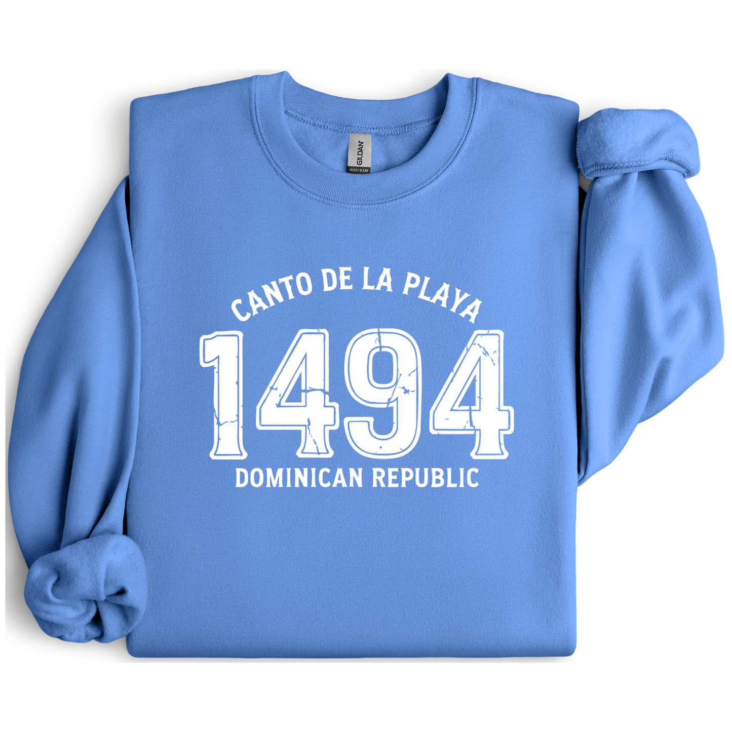 Gildan sweatshirt with “Canto De La Playa 1494 Dominican Republic” printed in distressed navy text. Vintage beach-inspired crewneck symbolizing Caribbean heritage and coastal charm. Made from soft cotton-poly blend fabric for comfort and style, ideal for beach lovers and travelers who adore Dominican culture. Cozy, sustainable, and perfect for casual wear or tropical getaways.