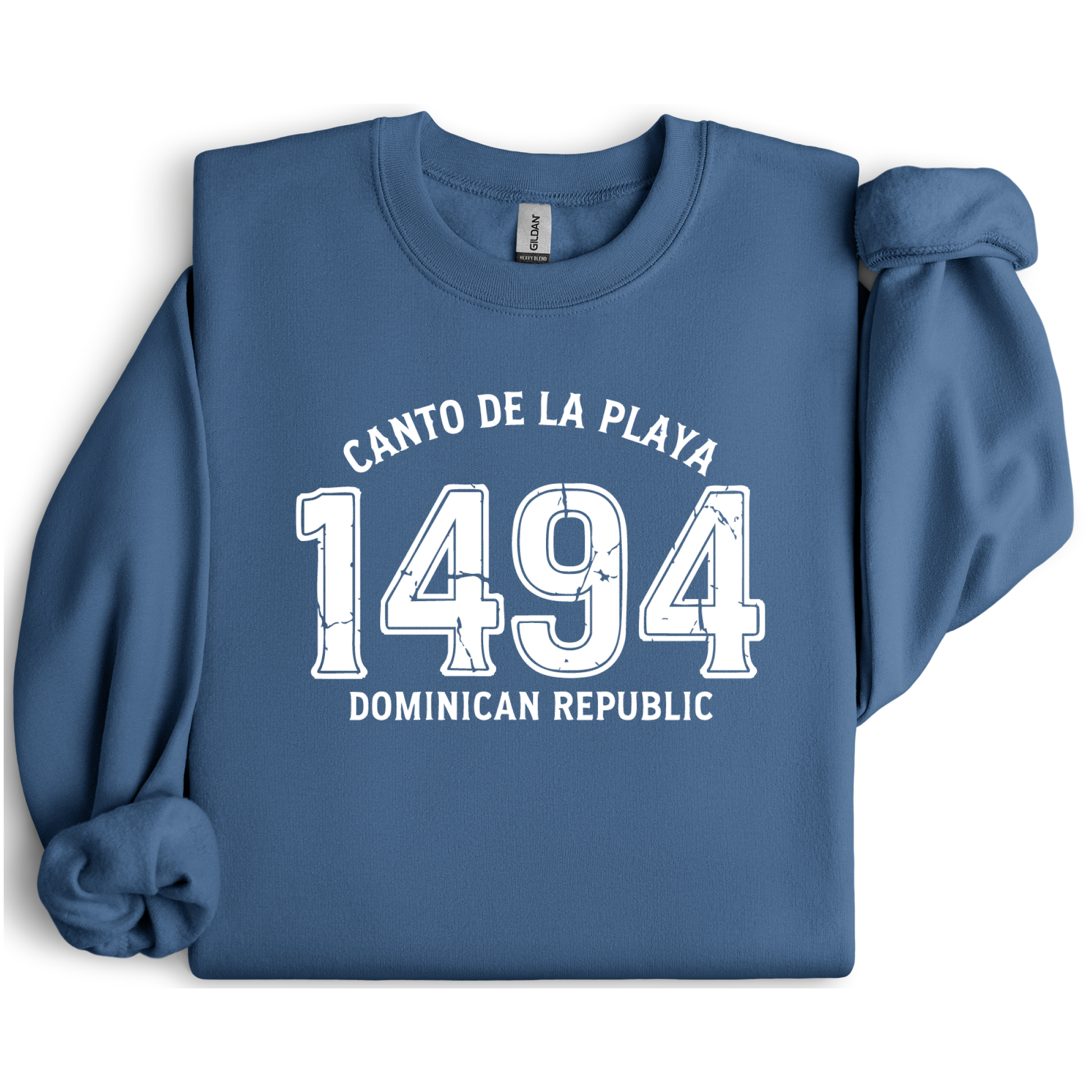 Gildan sweatshirt with “Canto De La Playa 1494 Dominican Republic” printed in distressed navy text. Vintage beach-inspired crewneck symbolizing Caribbean heritage and coastal charm. Made from soft cotton-poly blend fabric for comfort and style, ideal for beach lovers and travelers who adore Dominican culture. Cozy, sustainable, and perfect for casual wear or tropical getaways.