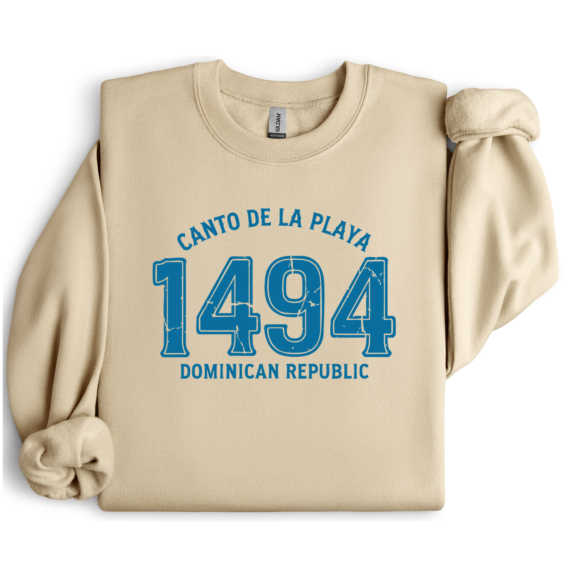 Gildan sweatshirt with “Canto De La Playa 1494 Dominican Republic” printed in distressed navy text. Vintage beach-inspired crewneck symbolizing Caribbean heritage and coastal charm. Made from soft cotton-poly blend fabric for comfort and style, ideal for beach lovers and travelers who adore Dominican culture. Cozy, sustainable, and perfect for casual wear or tropical getaways.