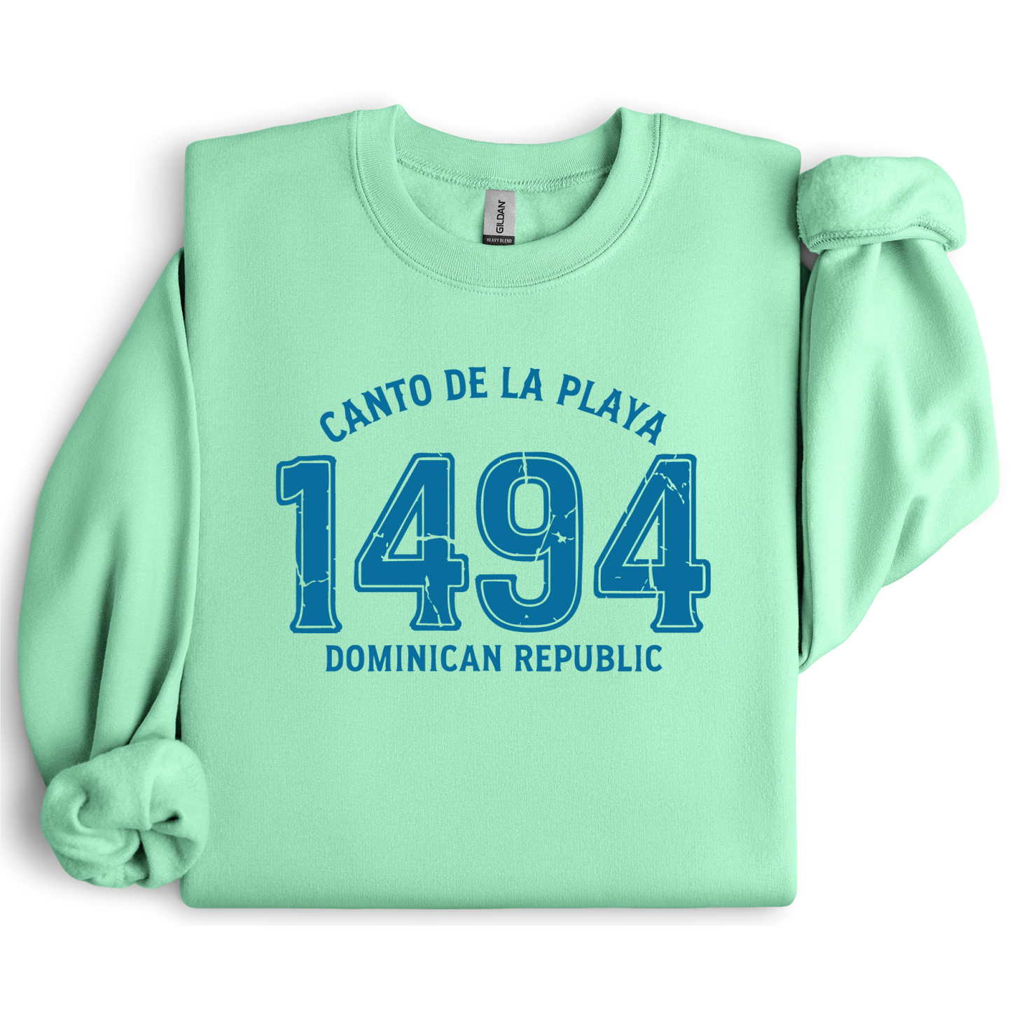 Gildan sweatshirt with “Canto De La Playa 1494 Dominican Republic” printed in distressed navy text. Vintage beach-inspired crewneck symbolizing Caribbean heritage and coastal charm. Made from soft cotton-poly blend fabric for comfort and style, ideal for beach lovers and travelers who adore Dominican culture. Cozy, sustainable, and perfect for casual wear or tropical getaways.