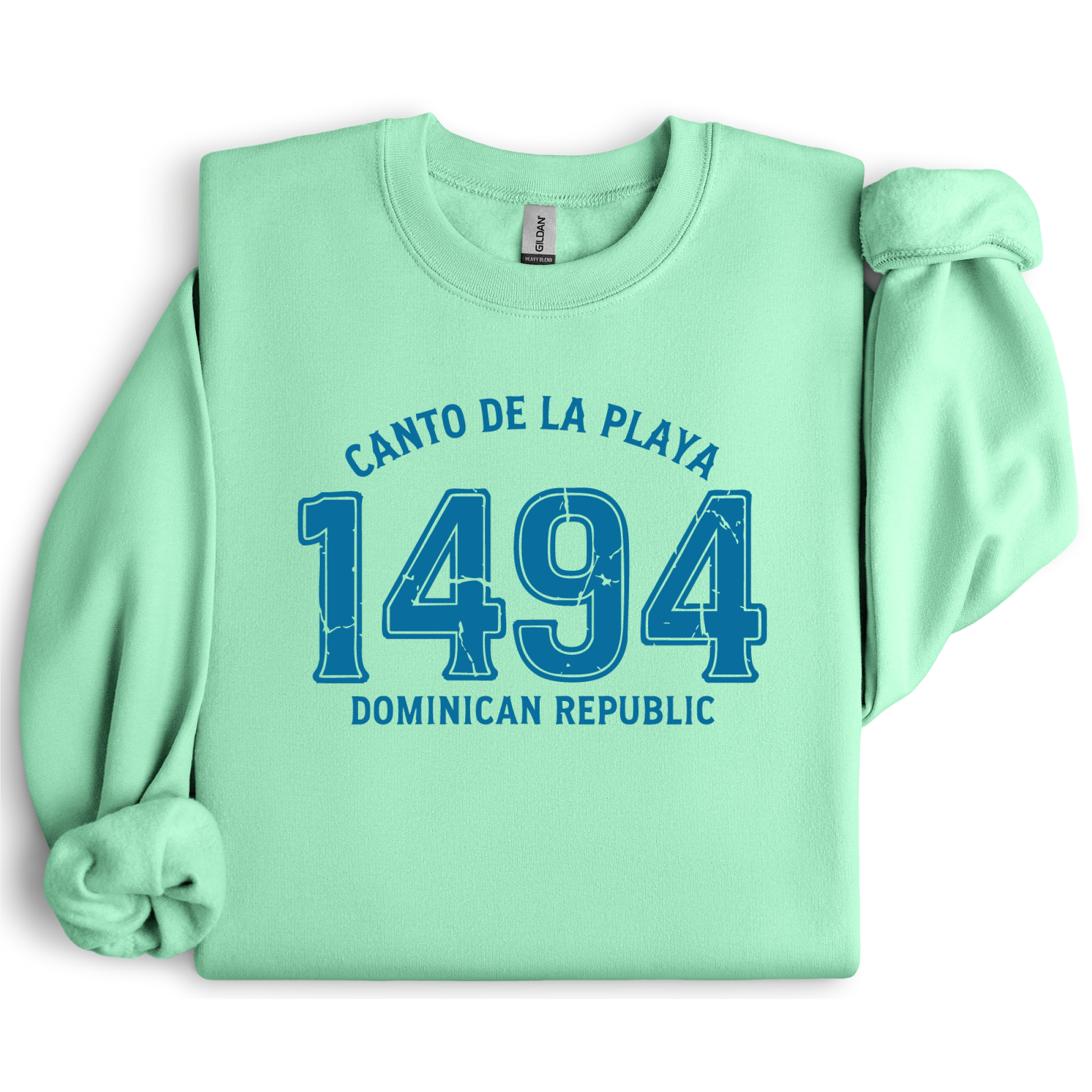 Gildan sweatshirt with “Canto De La Playa 1494 Dominican Republic” printed in distressed navy text. Vintage beach-inspired crewneck symbolizing Caribbean heritage and coastal charm. Made from soft cotton-poly blend fabric for comfort and style, ideal for beach lovers and travelers who adore Dominican culture. Cozy, sustainable, and perfect for casual wear or tropical getaways.