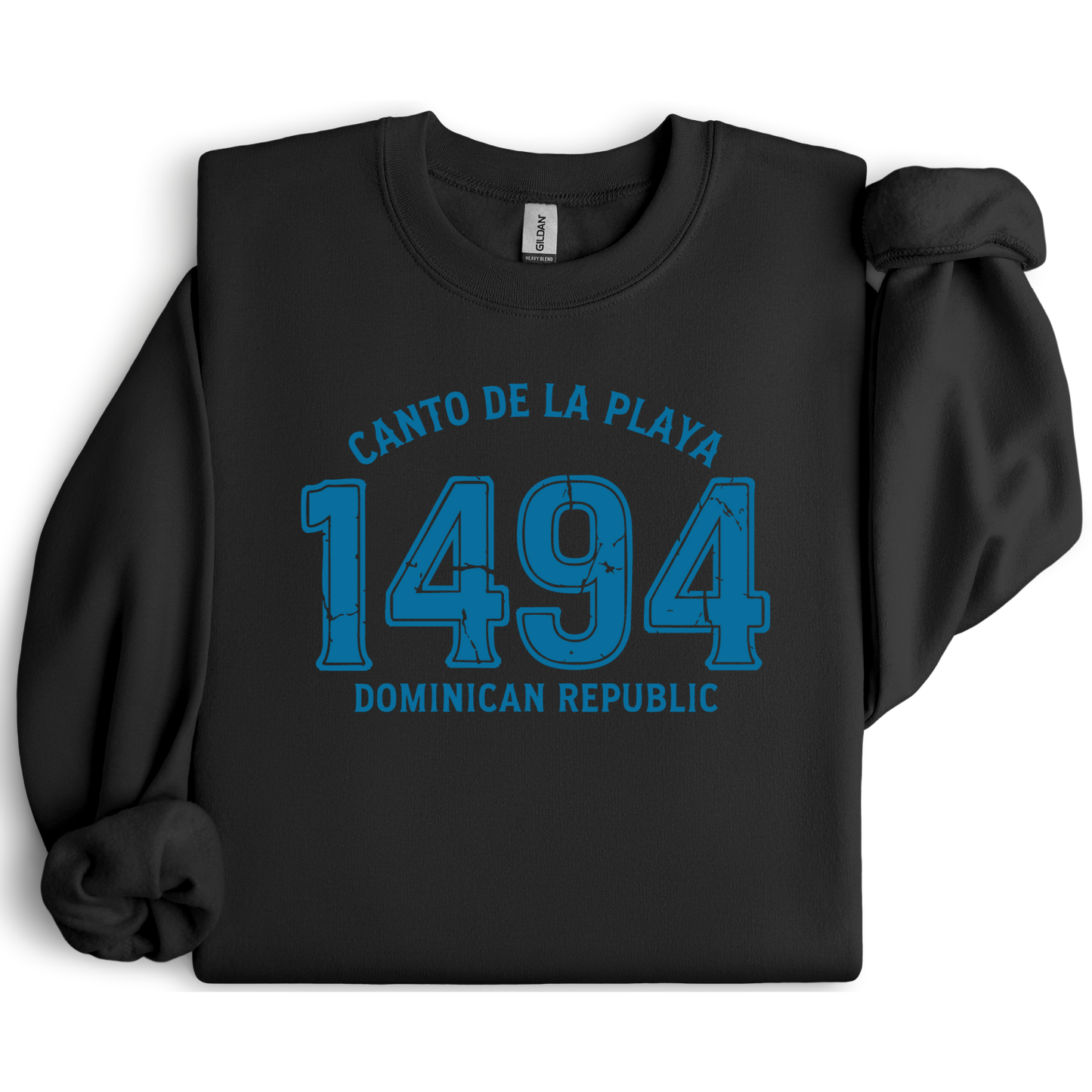 Gildan sweatshirt with “Canto De La Playa 1494 Dominican Republic” printed in distressed navy text. Vintage beach-inspired crewneck symbolizing Caribbean heritage and coastal charm. Made from soft cotton-poly blend fabric for comfort and style, ideal for beach lovers and travelers who adore Dominican culture. Cozy, sustainable, and perfect for casual wear or tropical getaways.