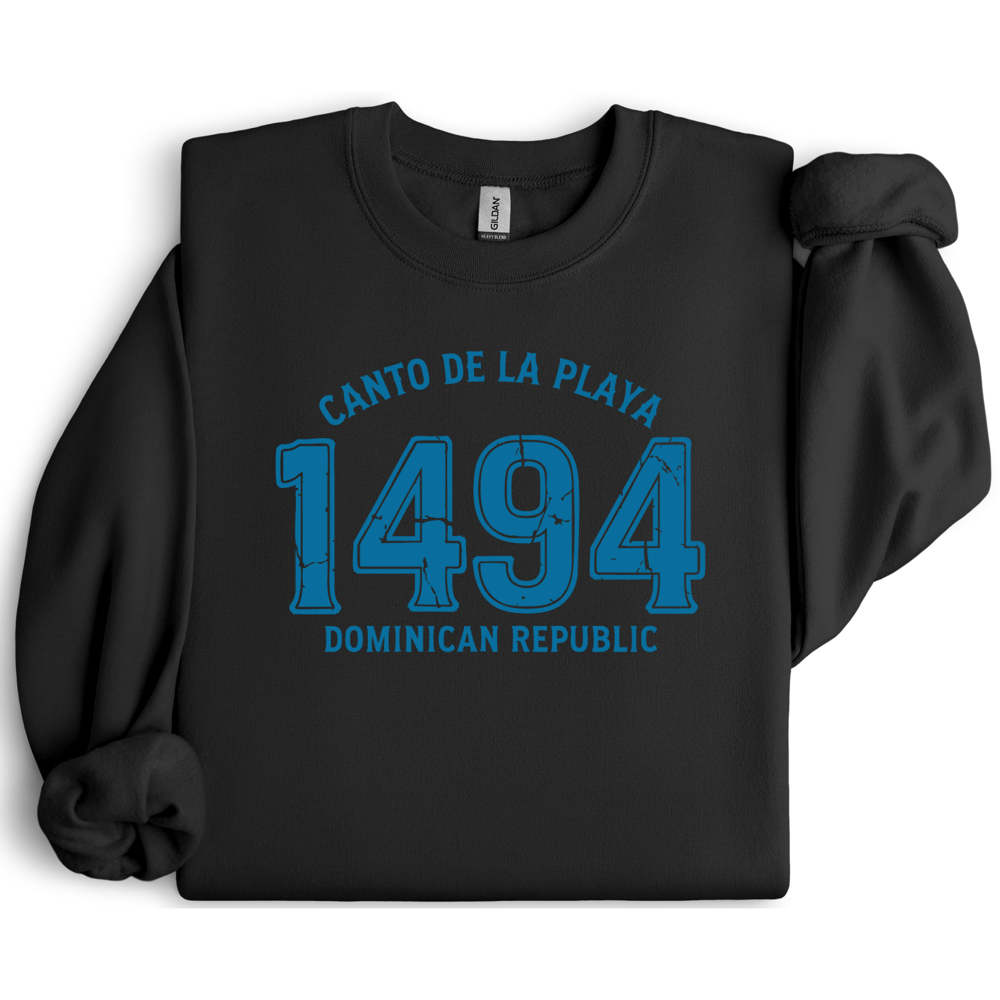 Gildan sweatshirt with “Canto De La Playa 1494 Dominican Republic” printed in distressed navy text. Vintage beach-inspired crewneck symbolizing Caribbean heritage and coastal charm. Made from soft cotton-poly blend fabric for comfort and style, ideal for beach lovers and travelers who adore Dominican culture. Cozy, sustainable, and perfect for casual wear or tropical getaways.
