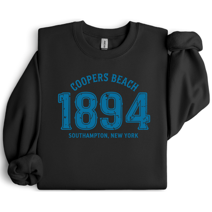 Black sweatshirt with blue text 'Coopers Beach 1894 Southampton, New York' on a white background