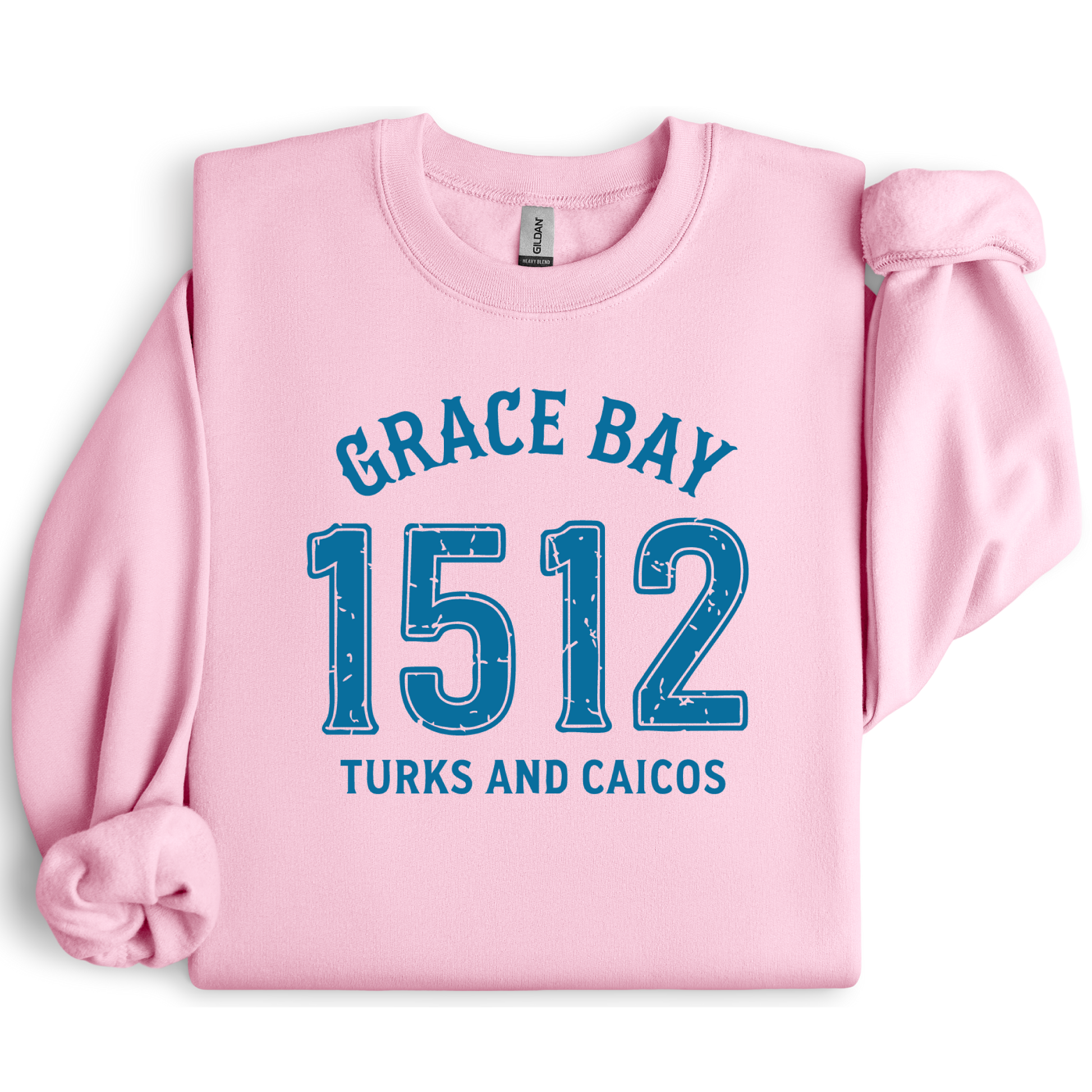 Gildan sweatshirt featuring blue text that reads “Grace Bay 1512 Turks and Caicos” in a vintage collegiate style. Cozy cotton-poly blend pullover with ribbed cuffs and waistband for a relaxed, durable fit. Ideal for beach lovers, island travelers, and fans of coastal fashion. Perfect for staying cozy while showcasing love for one of the Caribbean’s most beautiful beaches — Grace Bay.