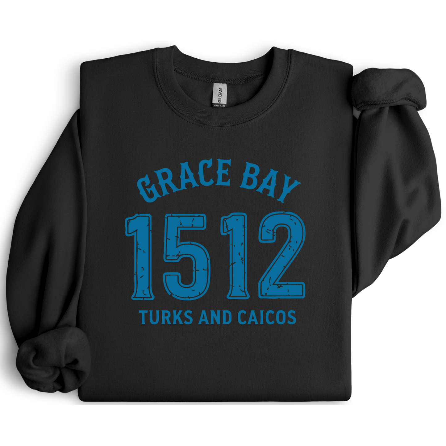 Gildan sweatshirt featuring blue text that reads “Grace Bay 1512 Turks and Caicos” in a vintage collegiate style. Cozy cotton-poly blend pullover with ribbed cuffs and waistband for a relaxed, durable fit. Ideal for beach lovers, island travelers, and fans of coastal fashion. Perfect for staying cozy while showcasing love for one of the Caribbean’s most beautiful beaches — Grace Bay.