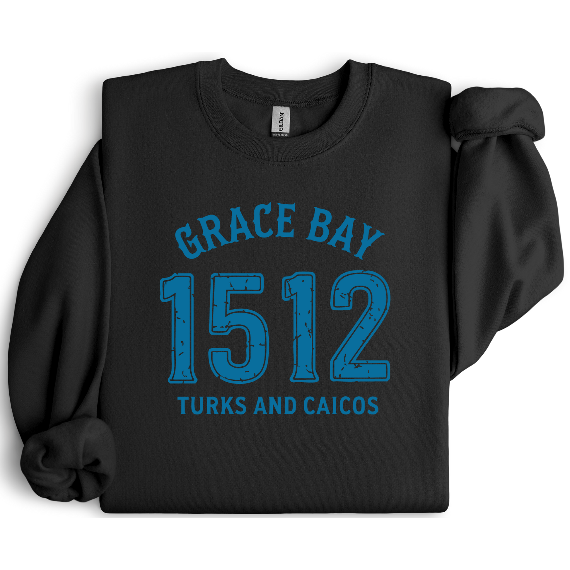 Gildan sweatshirt featuring blue text that reads “Grace Bay 1512 Turks and Caicos” in a vintage collegiate style. Cozy cotton-poly blend pullover with ribbed cuffs and waistband for a relaxed, durable fit. Ideal for beach lovers, island travelers, and fans of coastal fashion. Perfect for staying cozy while showcasing love for one of the Caribbean’s most beautiful beaches — Grace Bay.