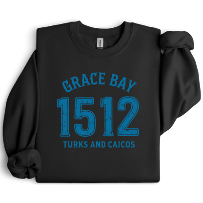 Gildan sweatshirt featuring blue text that reads “Grace Bay 1512 Turks and Caicos” in a vintage collegiate style. Cozy cotton-poly blend pullover with ribbed cuffs and waistband for a relaxed, durable fit. Ideal for beach lovers, island travelers, and fans of coastal fashion. Perfect for staying cozy while showcasing love for one of the Caribbean’s most beautiful beaches — Grace Bay.