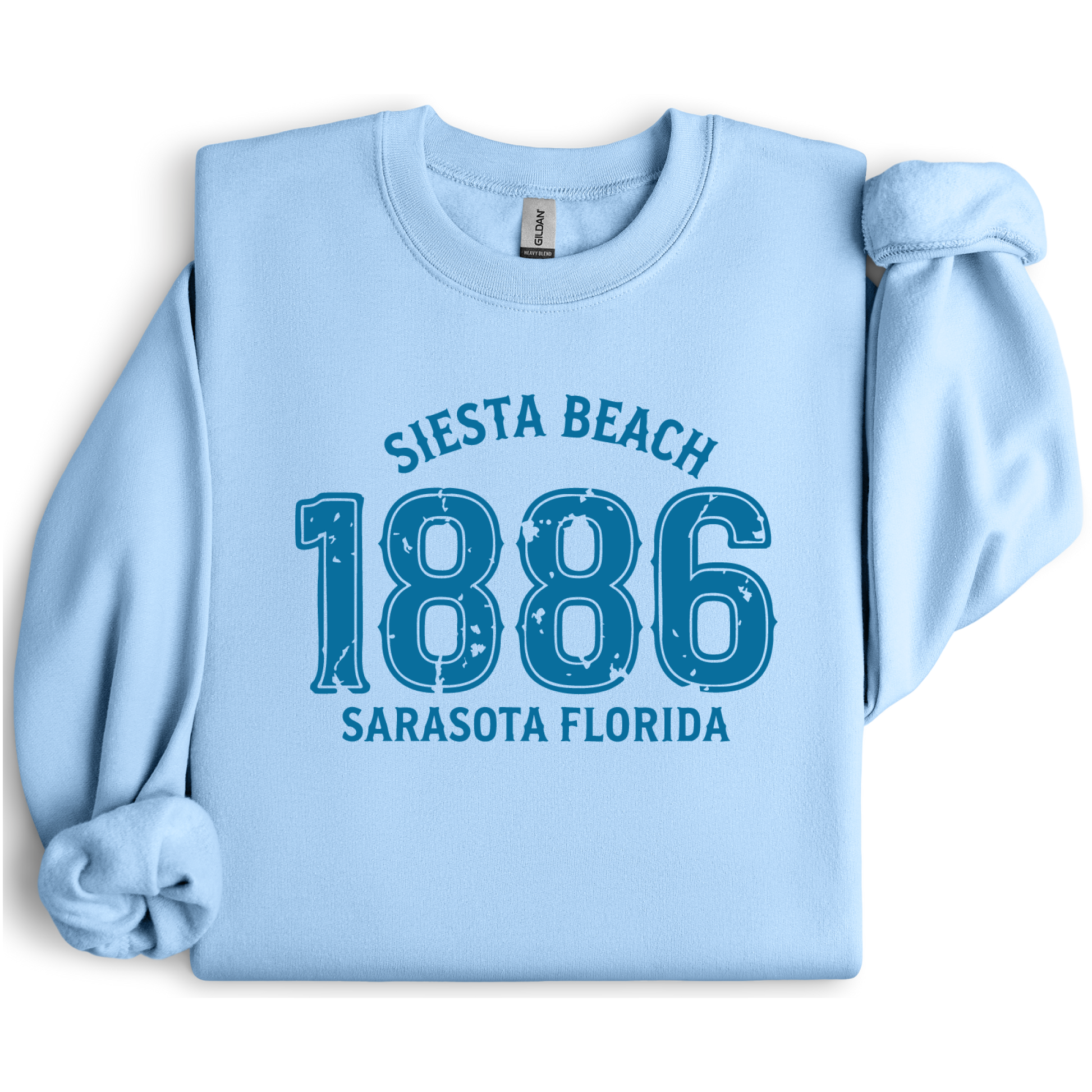 Light blue sweatshirt with 'Siesta Beach 1886 Sarasota Florida' text on a white background
