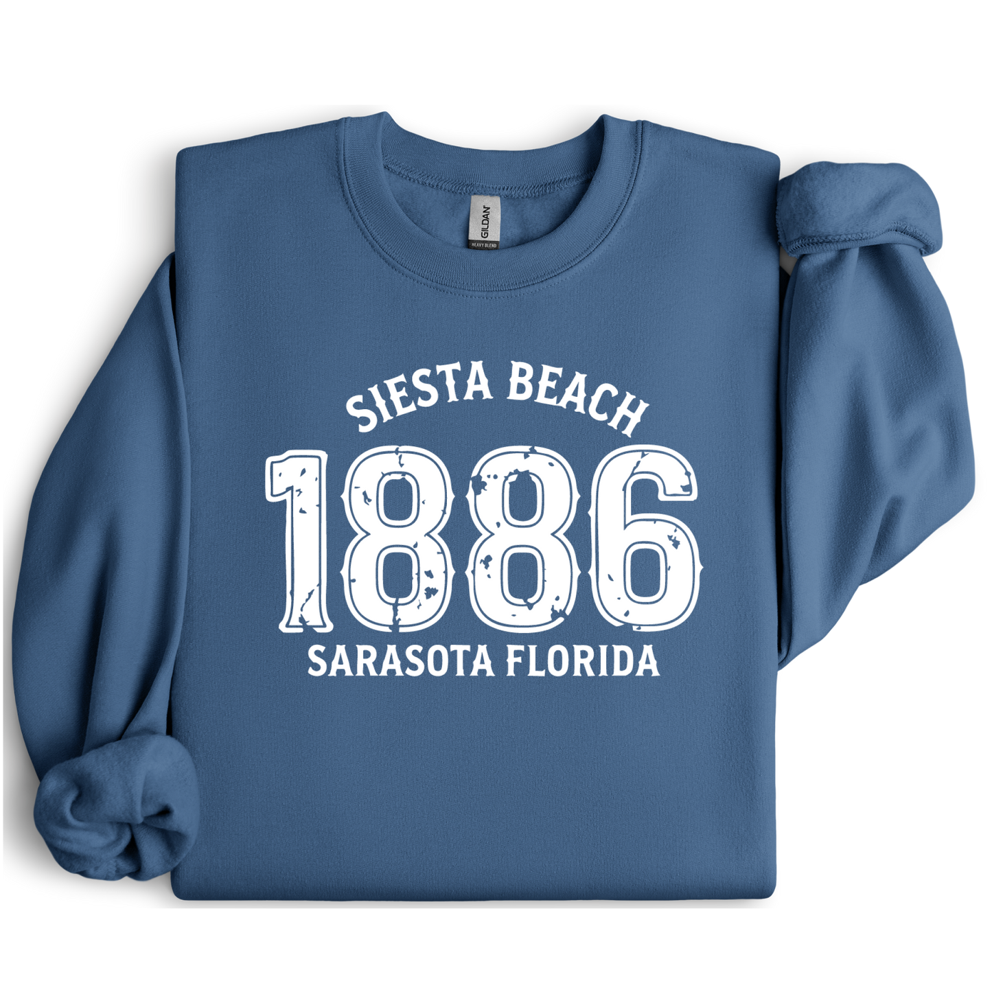 Indigo Blue sweatshirt with white text 'Siesta Beach 1886 Sarasota Florida' on a white background