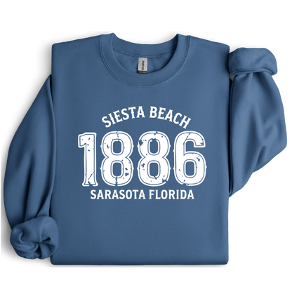 Indigo Blue sweatshirt with white text 'Siesta Beach 1886 Sarasota Florida' on a white background