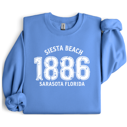 Carolina Blue sweatshirt with white text 'Siesta Beach 1886 Sarasota Florida' on a white background