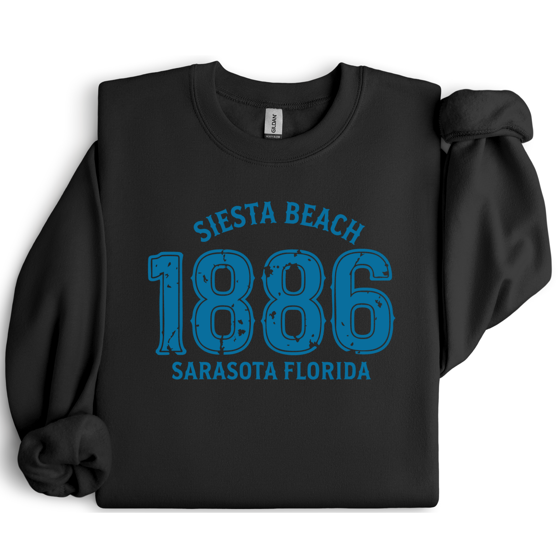 Black sweatshirt with blue text 'Siesta Beach 1886 Sarasota Florida' on a white background