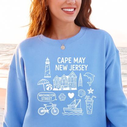 Gildan sweatshirt with blue Cape May New Jersey design featuring beach icons like a lighthouse, dolphin, beach ball, shells, and Washington Street sign. Coastal-inspired pullover made from soft cotton-poly blend fabric, ideal for beach lovers and Cape May fans. Perfect for seaside getaways or relaxing at home, this cozy crewneck celebrates the charm of New Jersey’s iconic coastal town.
