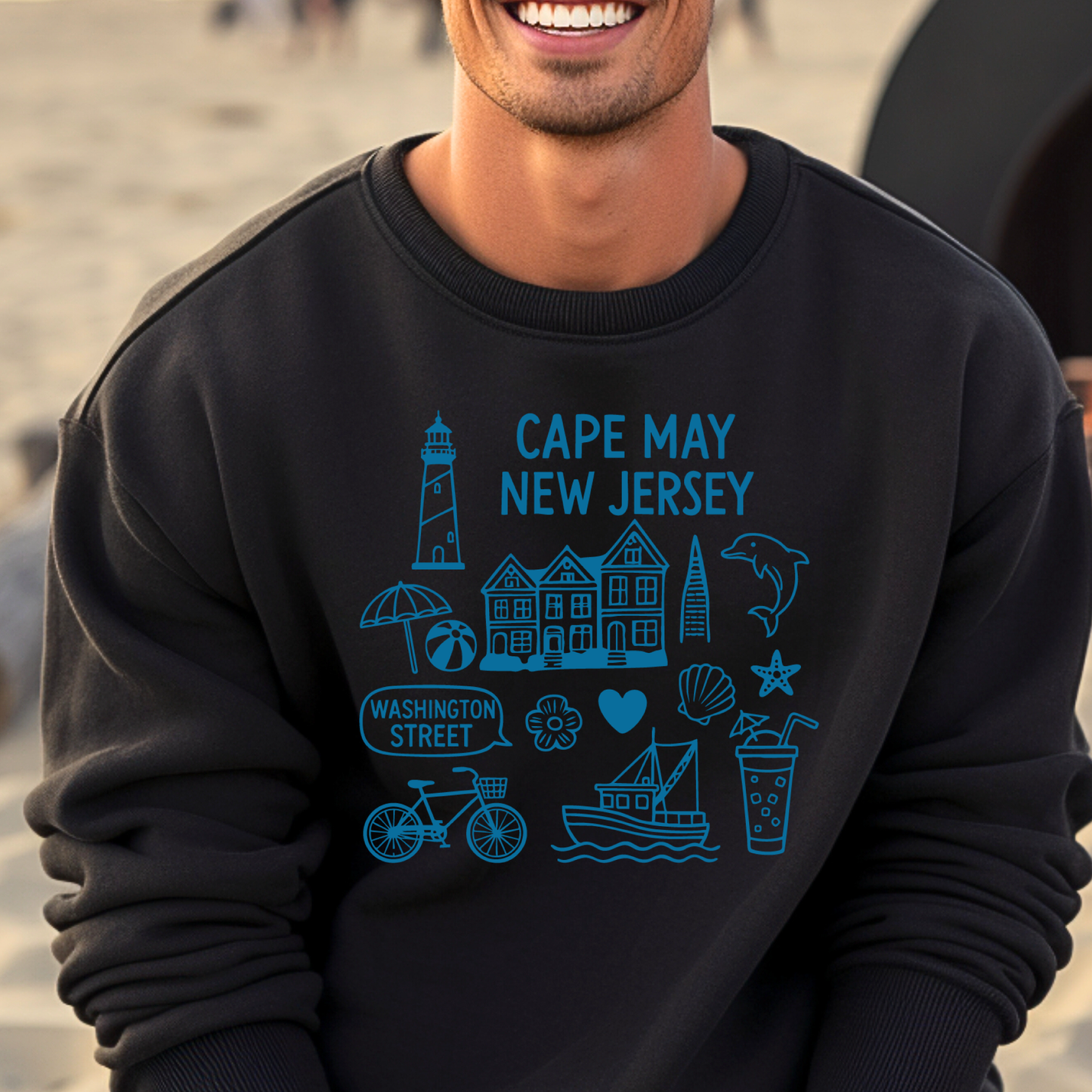 Gildan sweatshirt with blue Cape May New Jersey design featuring beach icons like a lighthouse, dolphin, beach ball, shells, and Washington Street sign. Coastal-inspired pullover made from soft cotton-poly blend fabric, ideal for beach lovers and Cape May fans. Perfect for seaside getaways or relaxing at home, this cozy crewneck celebrates the charm of New Jersey’s iconic coastal town.