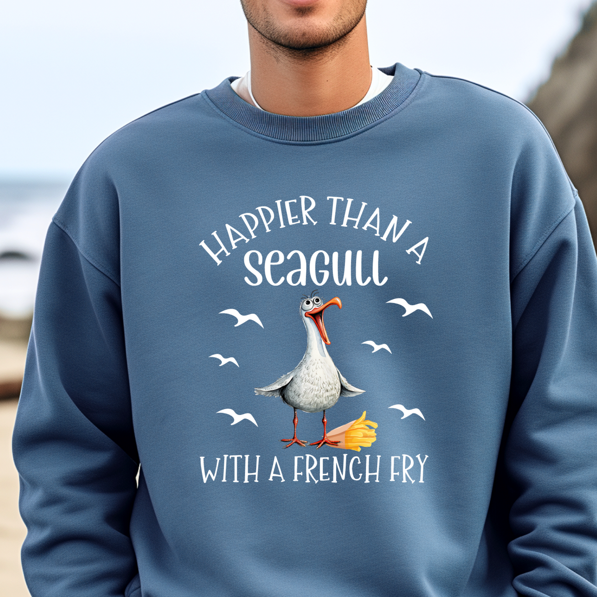 Person wearing a indigo blue sweatshirt with a seagull graphic and text.